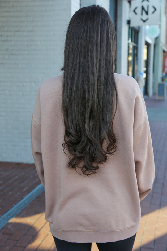 back view of the light Tan/Taupe oversized vintage wash crewneck with oversized ‘nash’ screen printed on the front