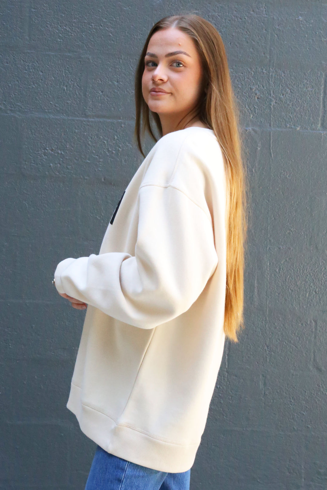 Side view of the Emma crewneck in tapioca 