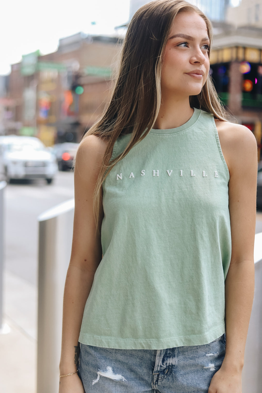 Model wearing the lena casual tank in sage on broadway 