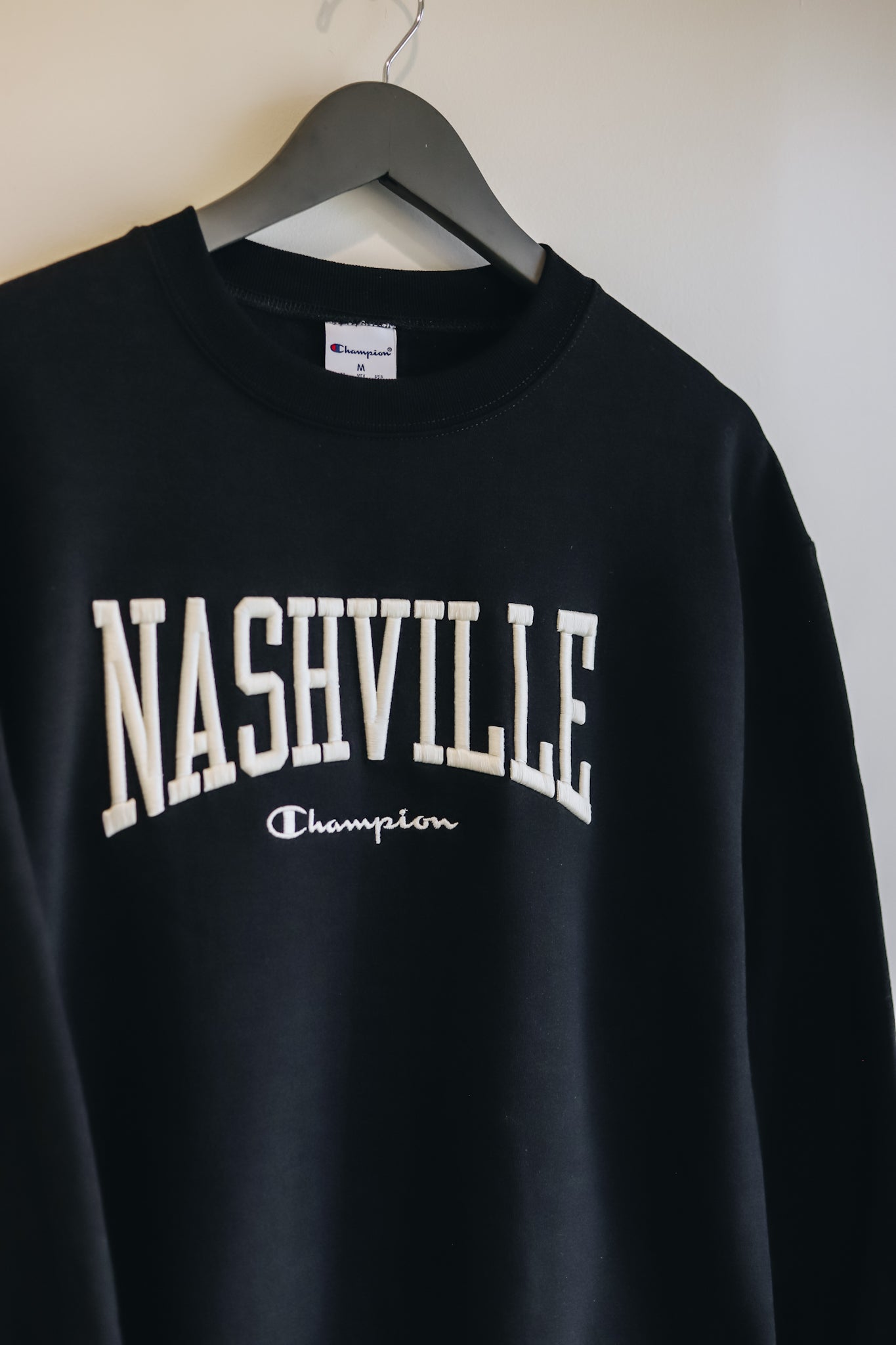 Up close view of the cream Nashville 3D embroidery across the chest