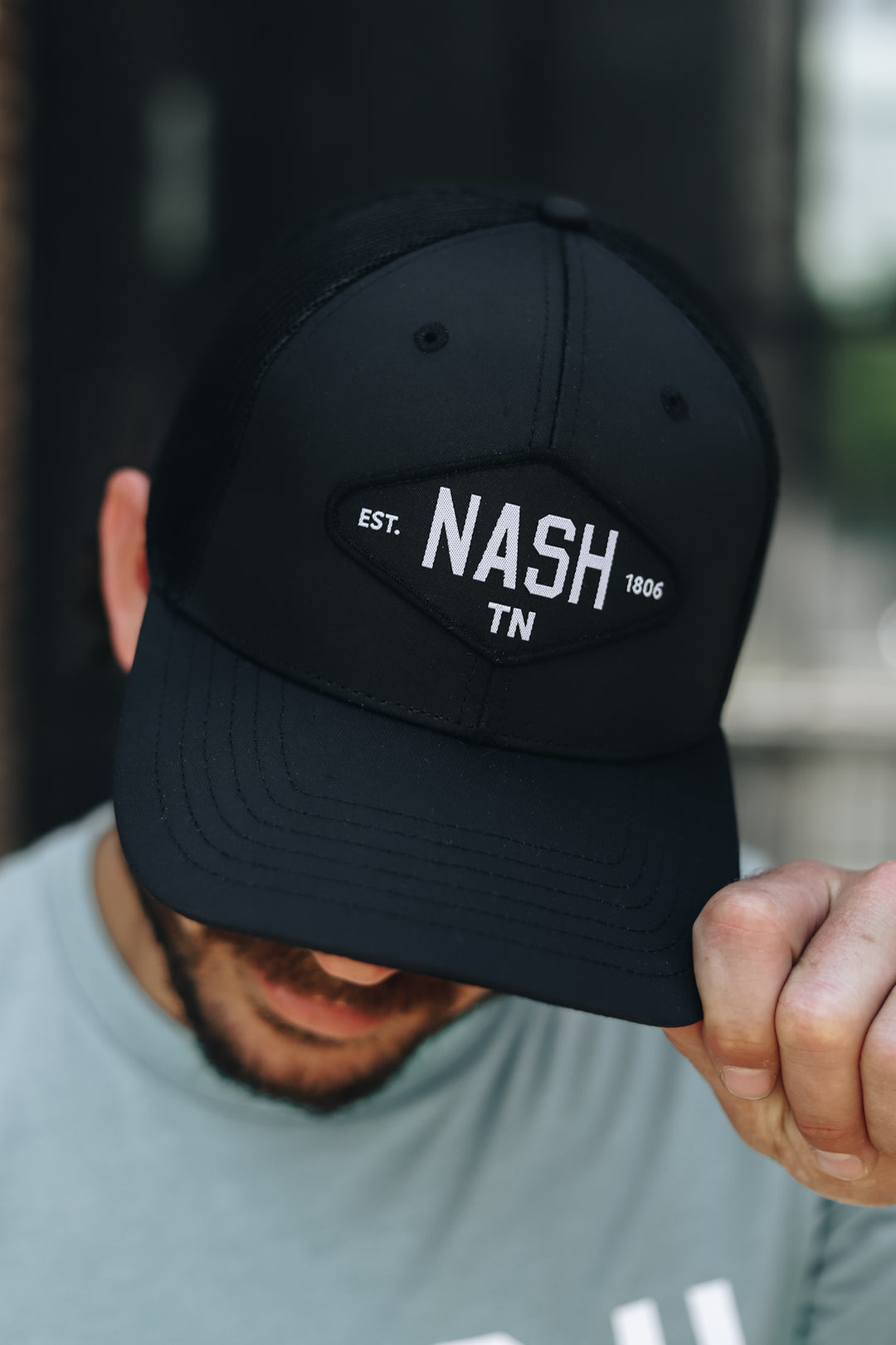 Up close view of the NASH Est. 1806 Trucker in black
