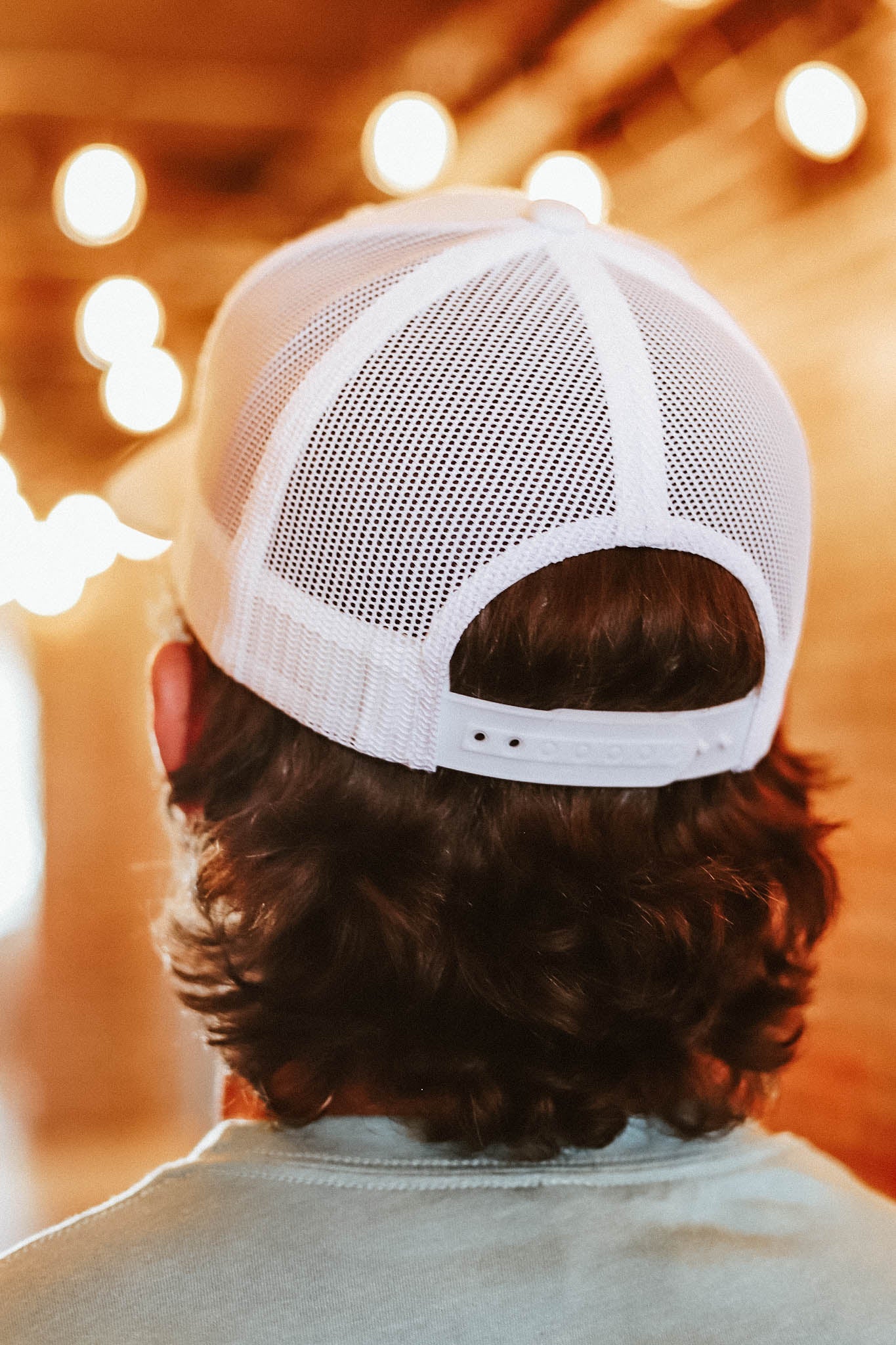 Back view of the white iconic leather patch trucker