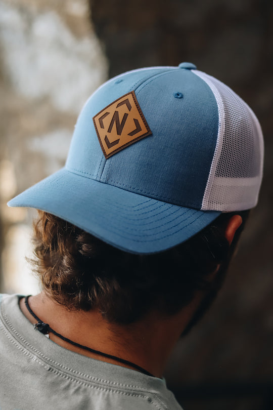 Iconic Leather Patch Trucker in light denim turned backwards 