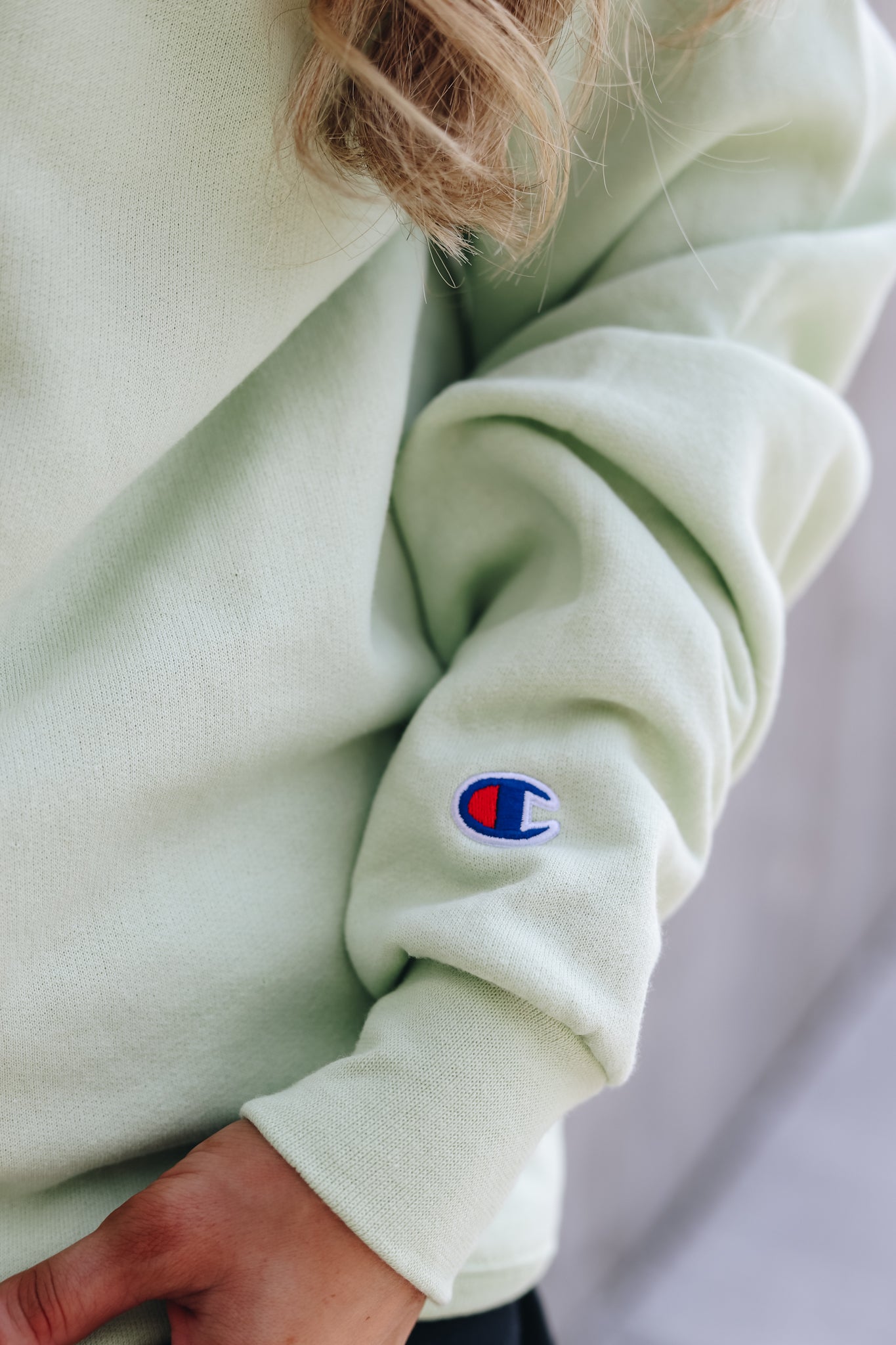 Embroidered Champion logo on sleeve cuff