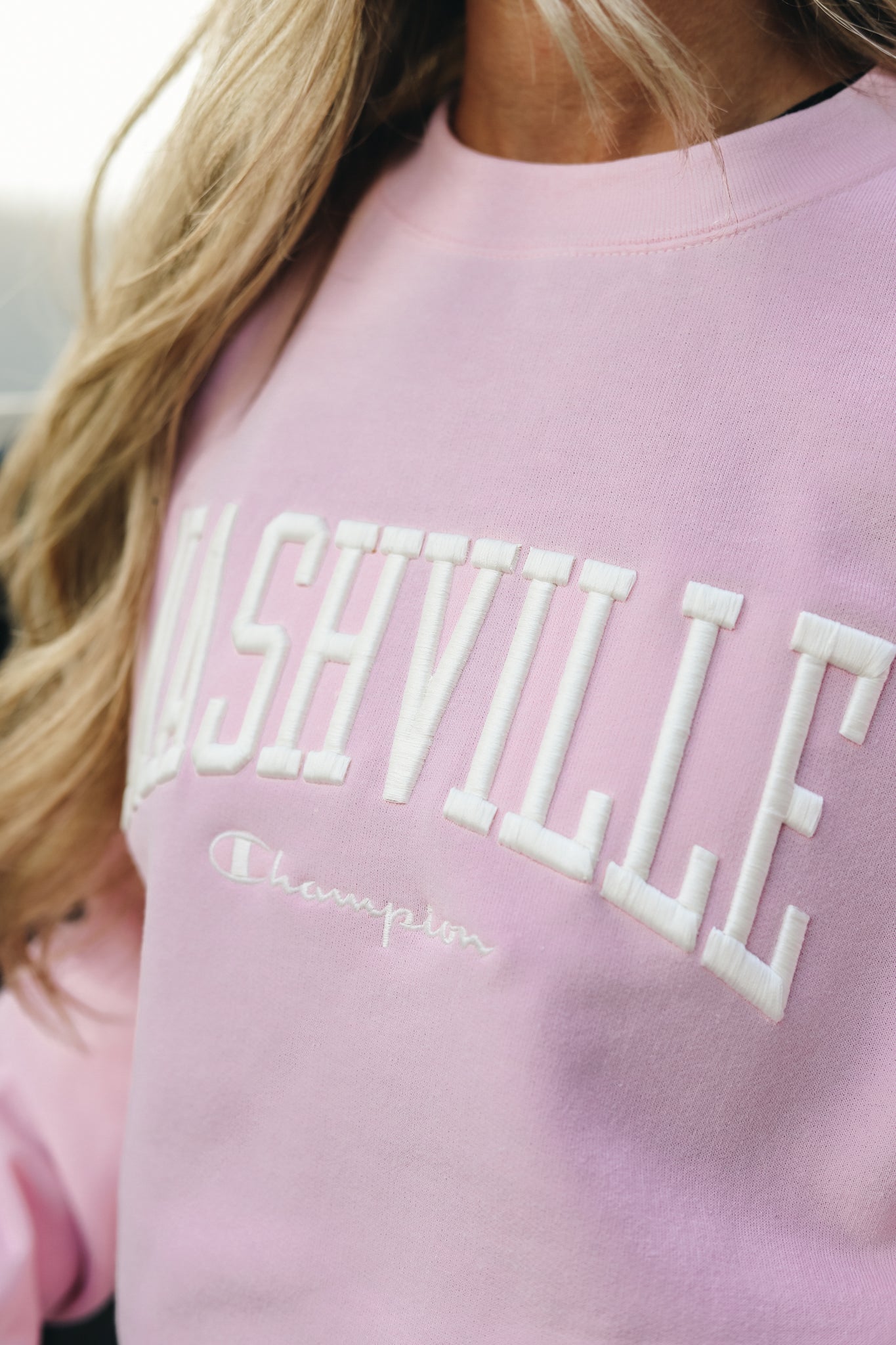 "Nashville" embroidered detail on the front chest of the Champion Embroidered Powerblend Crew