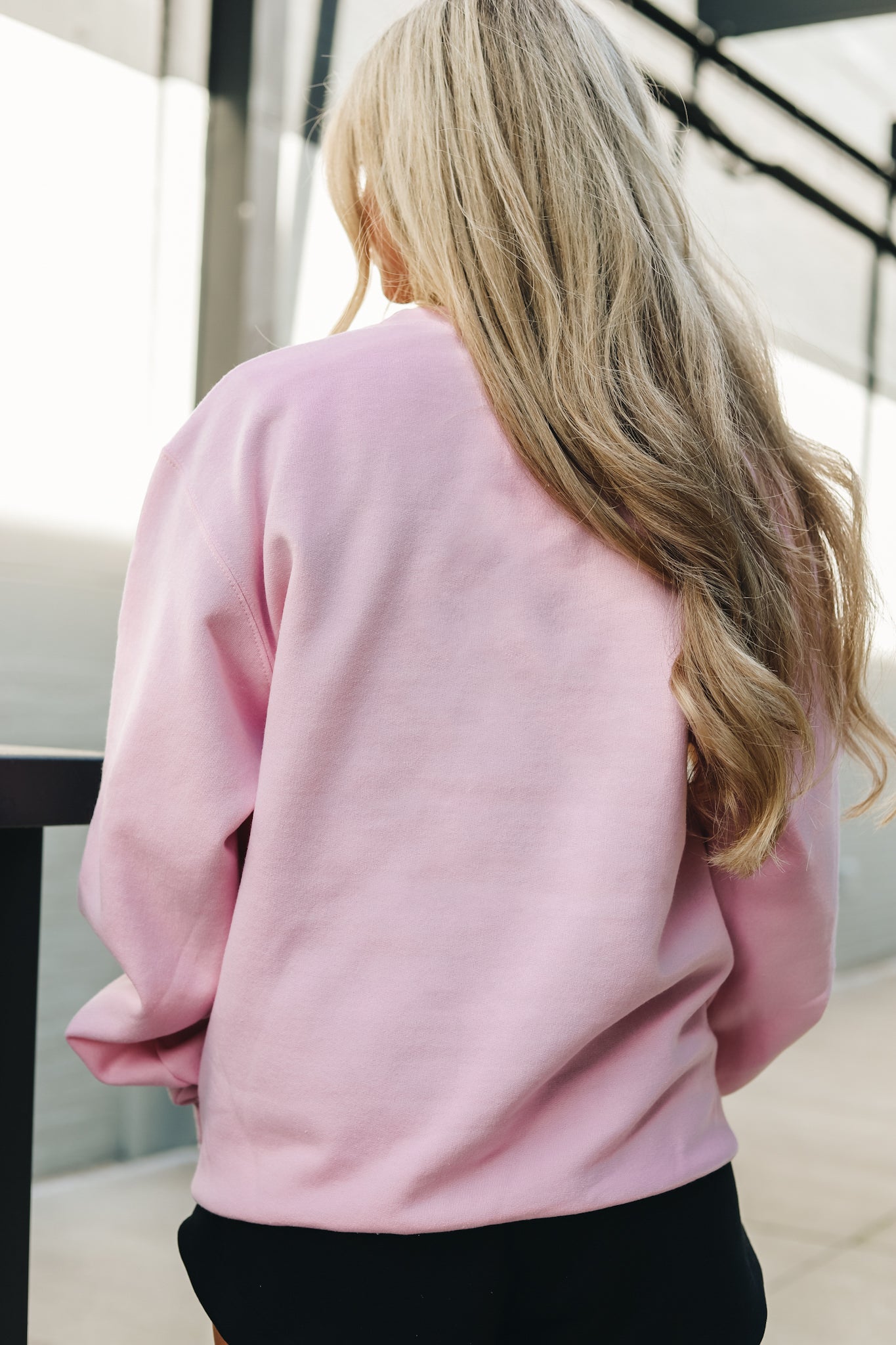 Back view of the Champion Embroidered Powerblend Crewneck in feather pink
