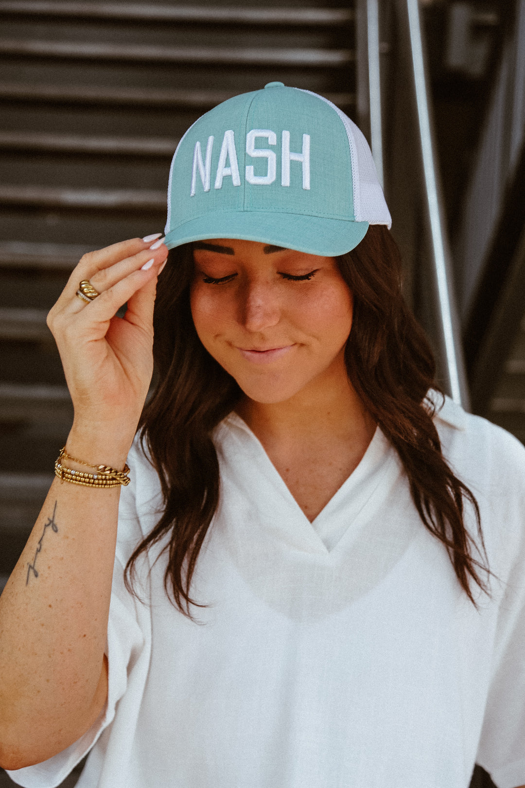Teal NASH trucker with white mesh.