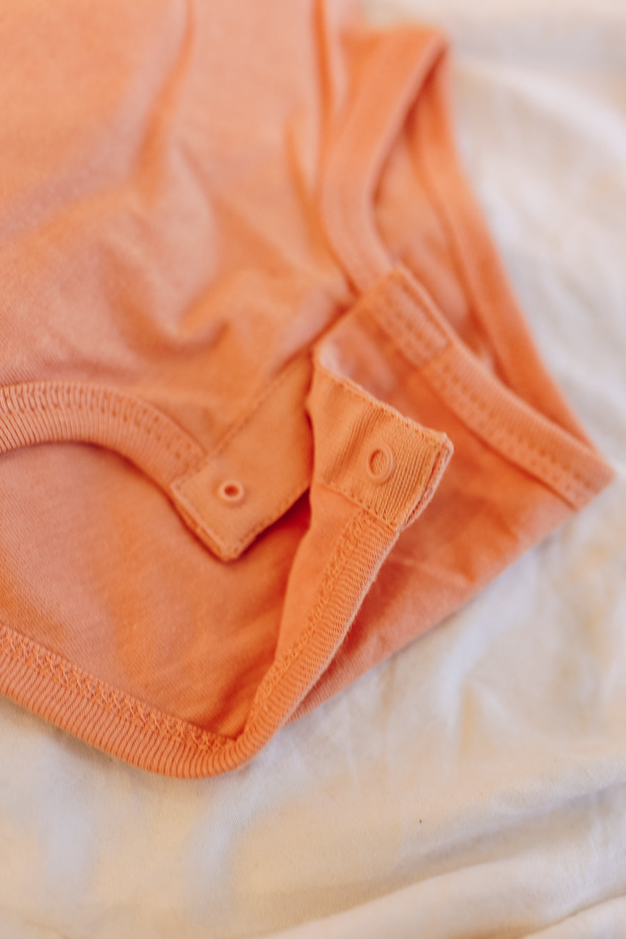 Reinforced three snap closure for ease.