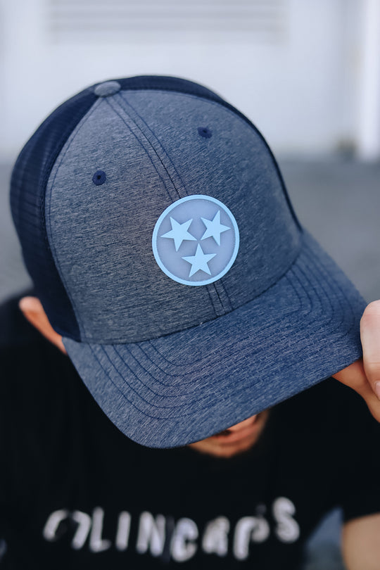 Navy trucker with light blue sonic weld tristar patch