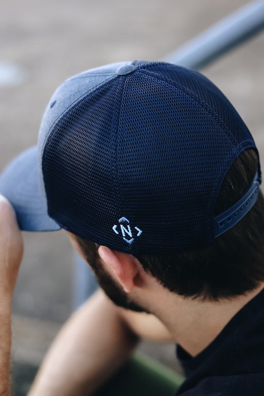 Back view of the navy mesh and navy snapback 