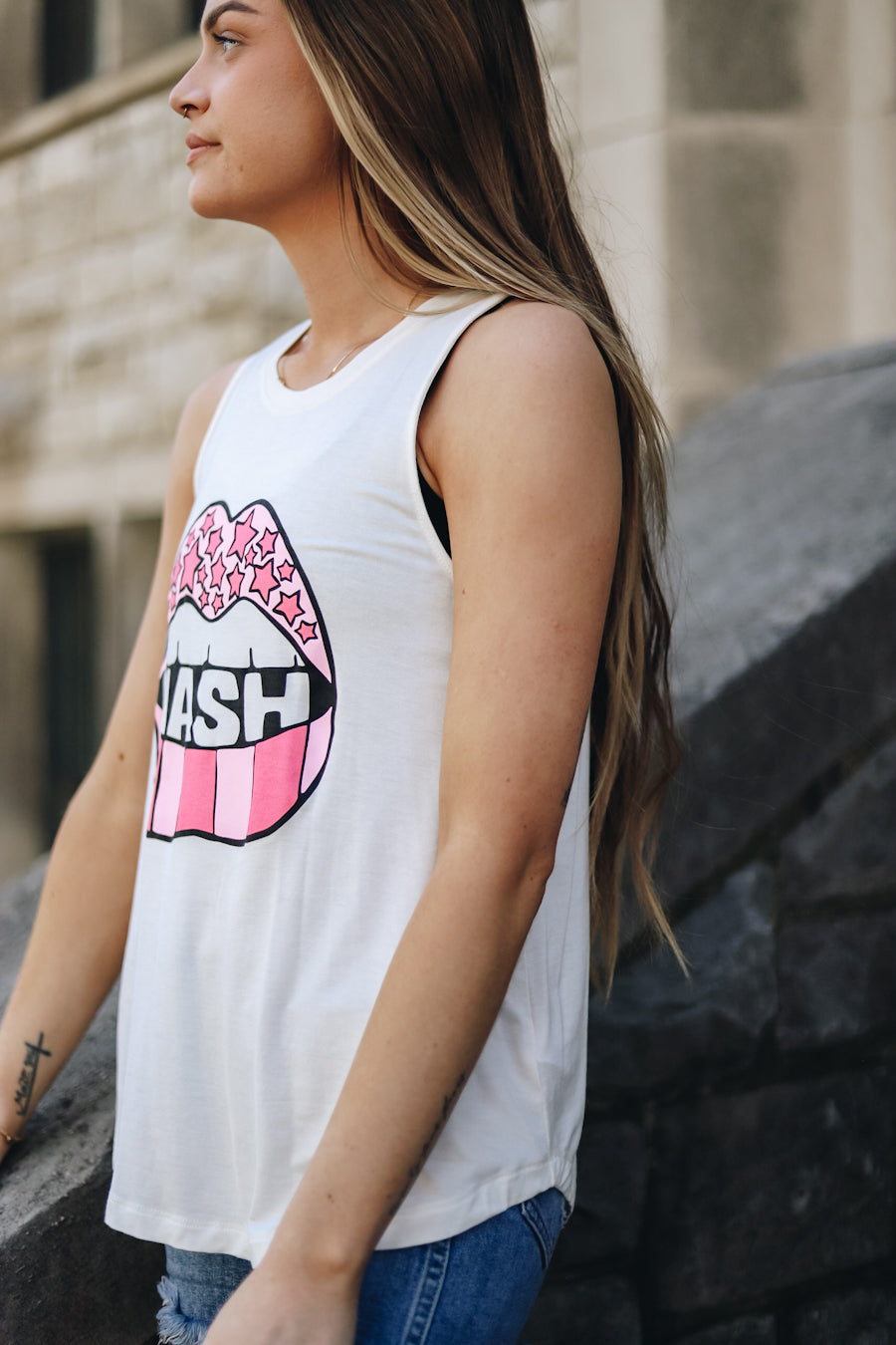 Side view of the white racerback tank with a pink lips nash design