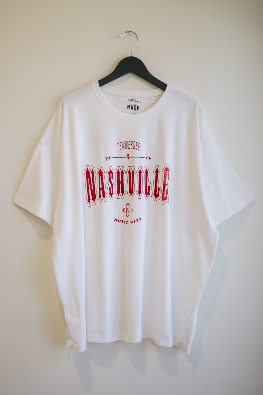 White oversize tee with a vintage inspired nashville graphic