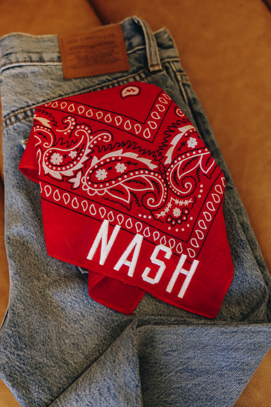 Red paisley bandana with white embroidered nash 